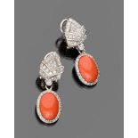 FINE PAIR OF EARRINGS

in white gold 18 kt., with set diamonds and pendants in coral surrounded by