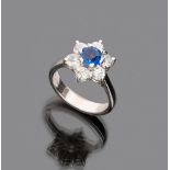 LOVELY RING

in white gold 18 kt., star shaped with central sapphire  and diamond surround.