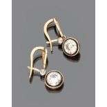 IMPORTANT PAIR OF EARRINGS

in gold and silver, circular shape with four round cut diamonds.

Length