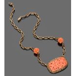 FINE COLLAR NECKLACE

in yellow gold 14 kt., with central coral engraved with floral design and