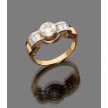 RING

in white gold and yellow gold 18 kt., with round cut central diamond and baguette cut