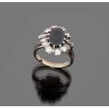 RING

in white gold 18 kt., with central sapphire and diamond surround. 

Sapphire ct. 2.50 ca.,