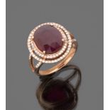 BEAUTIFUL RING in pink gold, with central ruby edged by diamonds. Ruby ct. 8.70, diamonds ct. 0.