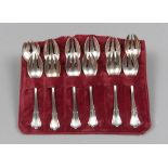 SERVICE OF TWELVE SILVER TEASPOONS, FIRST HALF 20TH CENTURY smooth body with vegetable edgings.
