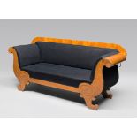 WOOD OF ELM SOFA, BIEDERMAIER PERIOD with dolphin and carved pods armrests. Feet cornucopia shaped