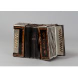 A SMALL ACCORDION, PROBABLY THE NETHERLANDS 20TH CENTURY with wooden and metal case with ebony inlay