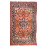 KUM CARPET, HALF 20TH CENTURY kurk wool, with a central medallion in blue and grounds with palms and