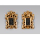 A PAIR OF GILT WOOD MIRROR, 19TH CENTURY with rectangular frame, graven to great twisted leaves.