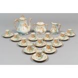 PORCELAIN COFFEE SERVICE, LIMOGES EARLY 20TH CENTURY with decorum to flowers on vanished blue.