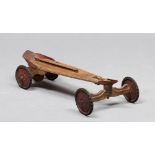 OLD WOODEN SCOOTER, EARLY 20TH CENTURY with red lacquer metal finishes. Measures cm. 20 x 80 x 39.