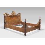 WALNUT BED, PROBABLY ROME, 19TH CENTURY finished in gilded wood, with movable backrest, adorned