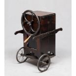 AN OLD WOOD HOOVER, ENGLAND EARLY 20TH CENTURY with parallelepiped case, steering wheel and metal