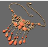 ELEGANT NECKLACE in yellow gold 18 kts., with central element pierced with spools of corals.