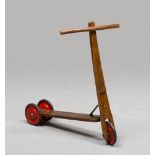 SCOOTER, EARLY 20TH CENTURY wood finishes and metal wheels. Measures cm. 67 x 70 x 13.