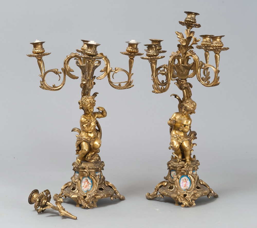 A PAIR OF GILDED BRONZE CANDLESTICK, 19TH CENTURY with five arms, garnished with seated figure of