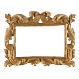 GILT WOODEN FRAME, 18TH CENTURY carved to twisted leaves and scrolls. Light cm. 30 x 20.