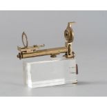 BRASS COLLIMATION TOOL, 20TH CENTURY mounted on plexiglass base. Measures cm. 12 x 11.