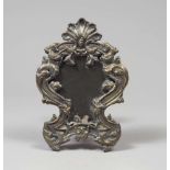 A SMALL SILVERED AND GILDED METAL MIRROR, 19TH CENTURY entirely hurled to roccailles, leaves and