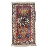 ANATOLIAN CARPET, EARLY 20TH CENTURY to Caucasian sketch 'lesghi', with triple medallion and