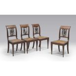 FOUR MAHOGANY CHAIRS, FRANCE, PERIOD OF THE DIRECTORY with curved backs and pierced by a palm tree