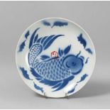 BLUE AND WHITE PORCELAIN DISH, CHINA 19TH CENTURY decorated with a pattern of big carp. Diameter cm.