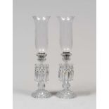 A PAIR OF CRYSTAL LIGHTS, 20TH CENTURY with stem and base bacellata and bells it engraved to