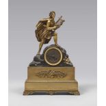 GILDED AND BURNISHED BRONZE TABLE CLOCK, EARLY 19TH CENTURY with classical figure with cedra on