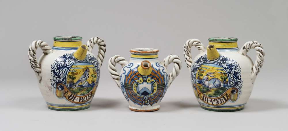 THREE MAJOLICA PITCHERS, 20TH CENTURY from seventeenth-century models, to white enamel with decorums