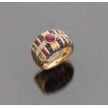 RING to band in yellow gold 18 kts., embellished with ruby central oval cut and sapphires,