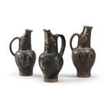 THREE ETRUSCAN OINOCHOAI OF THE GROUP OF THE GHOST, 4TH SECOLO B.C. in clay and opaque black