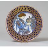 CERAMIC DISH, G. MAGNANELLI GUBBIO 1989 decorum to prince's figure with cup and edge to feathers