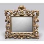 GILDED WOOD MIRROR, EARLY 20TH CENTURY Luis 15th styles, with graven frame to twisted leaves.