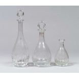 THREE GLASS BOTTLES, CARTIER XXTH CENTURY Marks engraved under the base. Maximum measures cm. 30 x