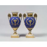 A PAIR OF PORCELAIN VASES, 19TH CENTURY to enamel cobalt and gold with decorums to garlands and