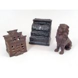 MONEY BOXES. Three cast iron money boxes.