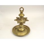 BRASS STAND. A cast brass stand, possibly Middle Eastern. 32cm.