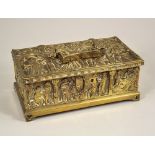 BRASS CASKET. A Gothic revival brass casket cast with religious & other figures figures.