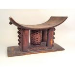 ASHANTI STOOL. An Ashanti carved stool. Height 31cm x width 47cm.