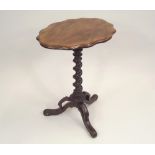 TRIPOD TABLE. A Victorian mahogany table with spiral column & pierced triform feet. Height 70cm.