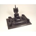 EBONY WATCH STAND. An ebony watch stand with candlesticks, stud box etc. 18 x 27cm.