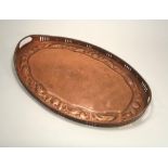 NEWLYN COPPER. A Newlyn oval, twin-handled tray. Stamped 'NEWLYN'. Diameter 55cm. x 37cm.