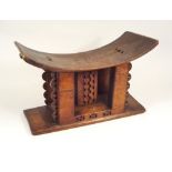 ASHANTI STOOL. An Ashanti small carved wood stool. Height 22cm x width 38cm.