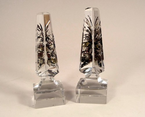 GLASS PRISMS. A pair of glass prism obelisks with enamel decoration. Height 17cm.