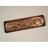 NEWLYN COPPER. A Newlyn copper pen tray. Stamped 'NEWLYN'. 7 x 26cm.