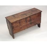 OAK COFFER. An early planked oak coffer, possibly 17th century, the ends simply shaped. Height 56cm.