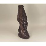 AFRICAN HEAD. An African carved hardwood head, later drilled as a lamp base. Height 40cm.