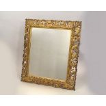 MIRROR. A large mirror with carved gilt wood frame. 80 x 71cm.