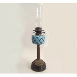 OIL LAMP. A Victorian oil lamp with blue opaque moulded glass fount & brass fluted column.