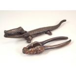 NUT CRACKERS. A pair of cast iron crocodile nut crackers & one other pair of nut crackers.