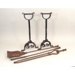 ANDIRONS ETC. A pair of wrought iron andirons, height 49cm & a set of three steel fire irons.